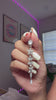Rapunzel Belly Ring dangle shown close up in hand